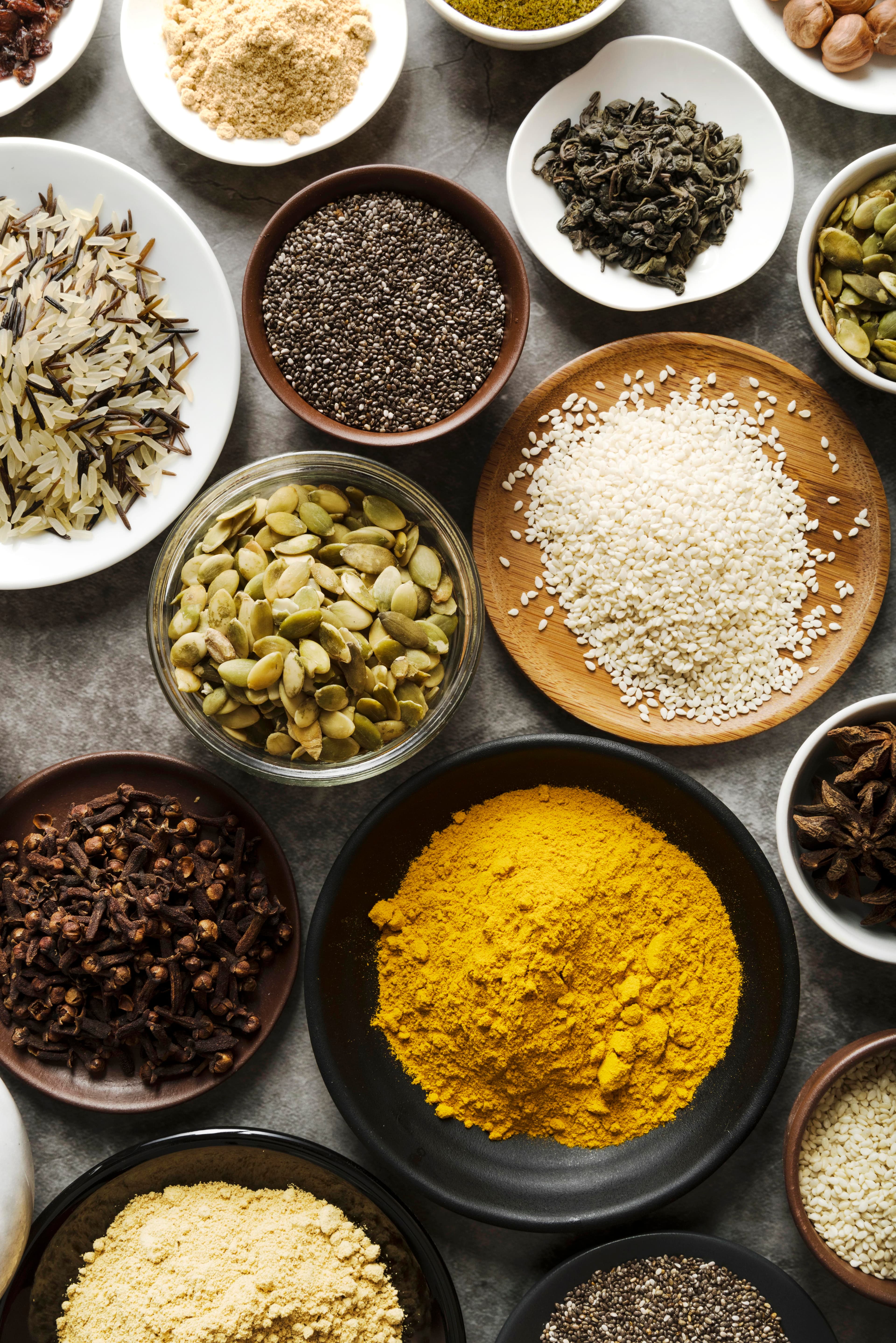 Spices, seeds, and pantry ingredients in bowls